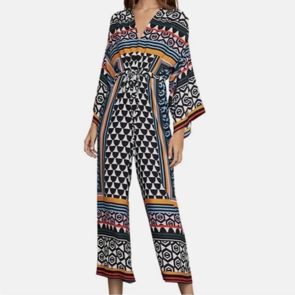 BCBG Maxazria jumpsuit with adjustable tie at the waist. Never worn, tags on.